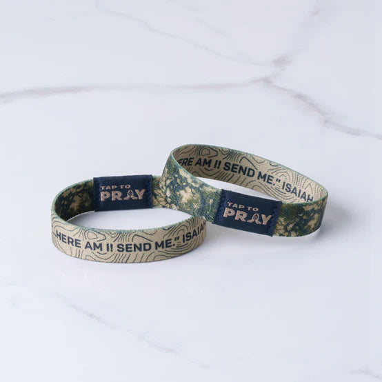 Two camouflage-patterned wristbands with 'TAP to Pray' text on a white background showing the two reversible sides to it