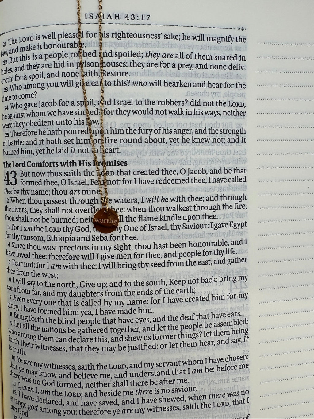 Necklace with a circular pendant on an open bible