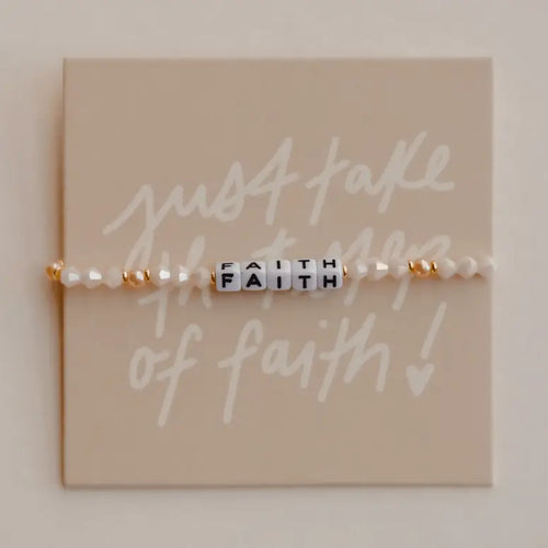 Bracelet with 'faith' beads on a card with motivational text