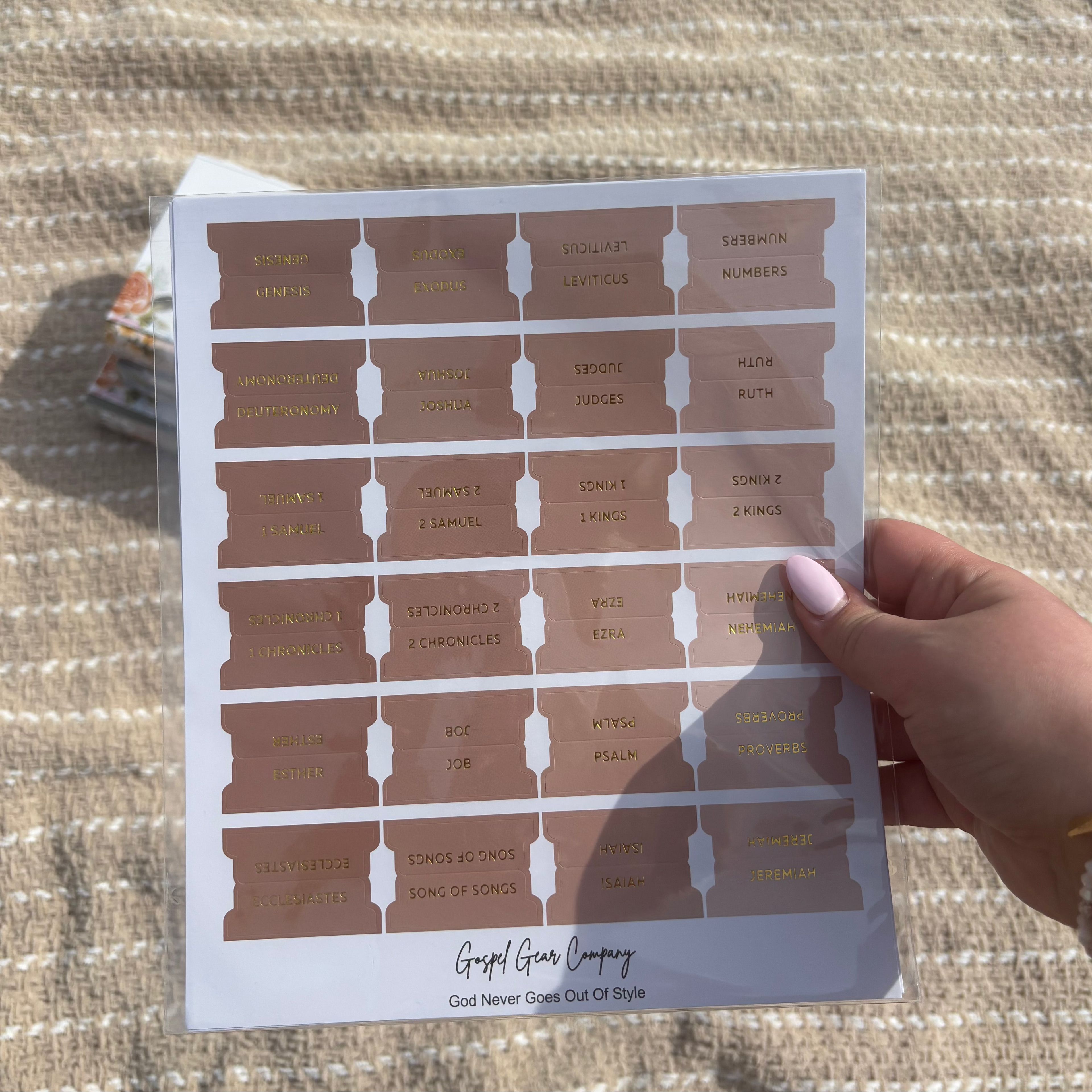 Sand Dune Bible tabs with floral Bibles behind the tabs with a beige blanket outside