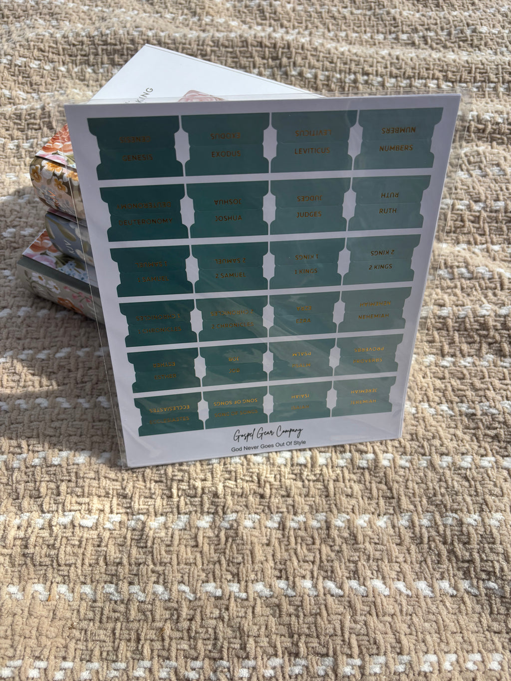 Sea Foam Green Bible tabs propped against floral Bibles laying on a beige blanket outside