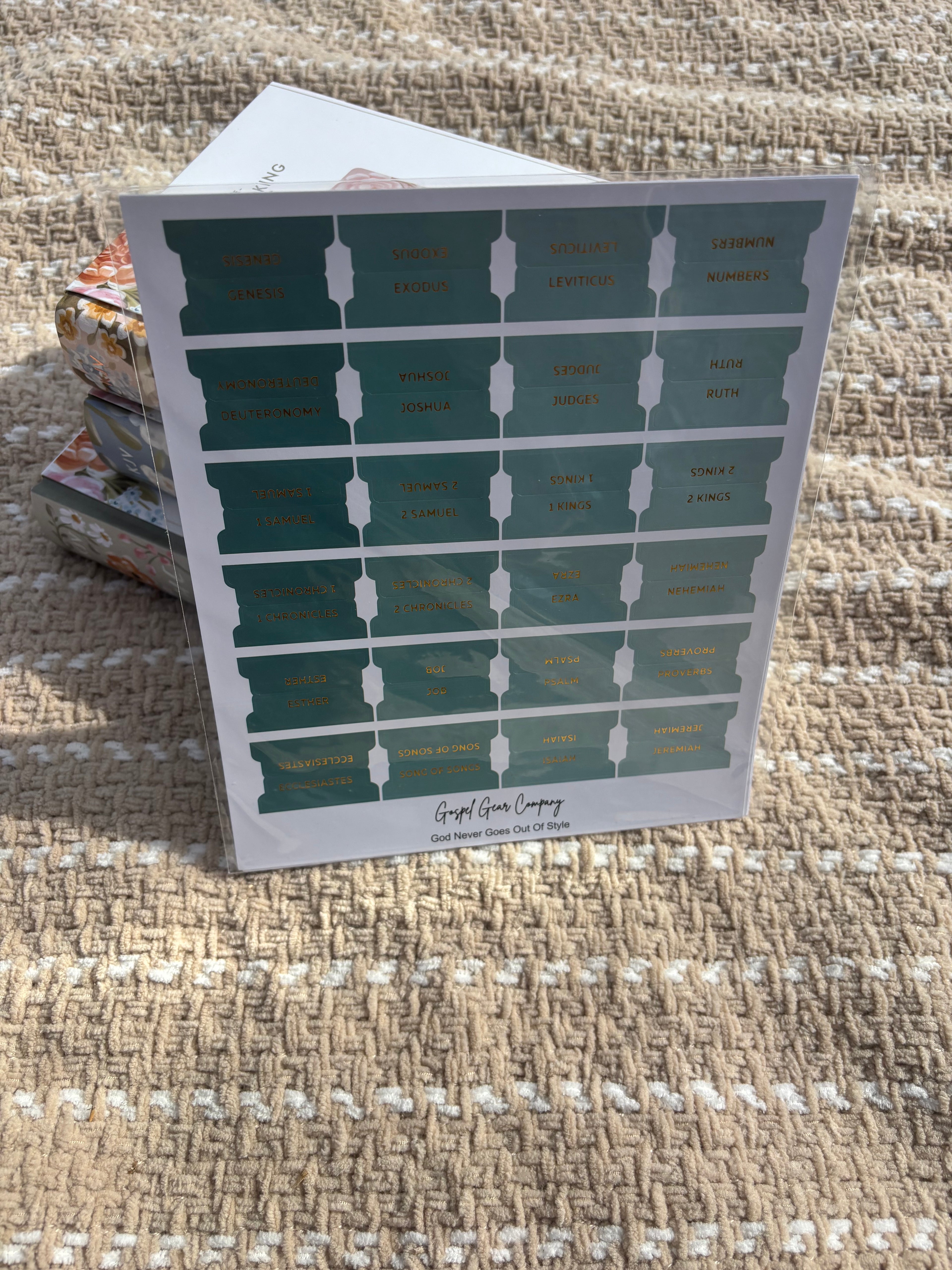 Sea Foam Green Bible tabs propped against floral Bibles laying on a beige blanket outside