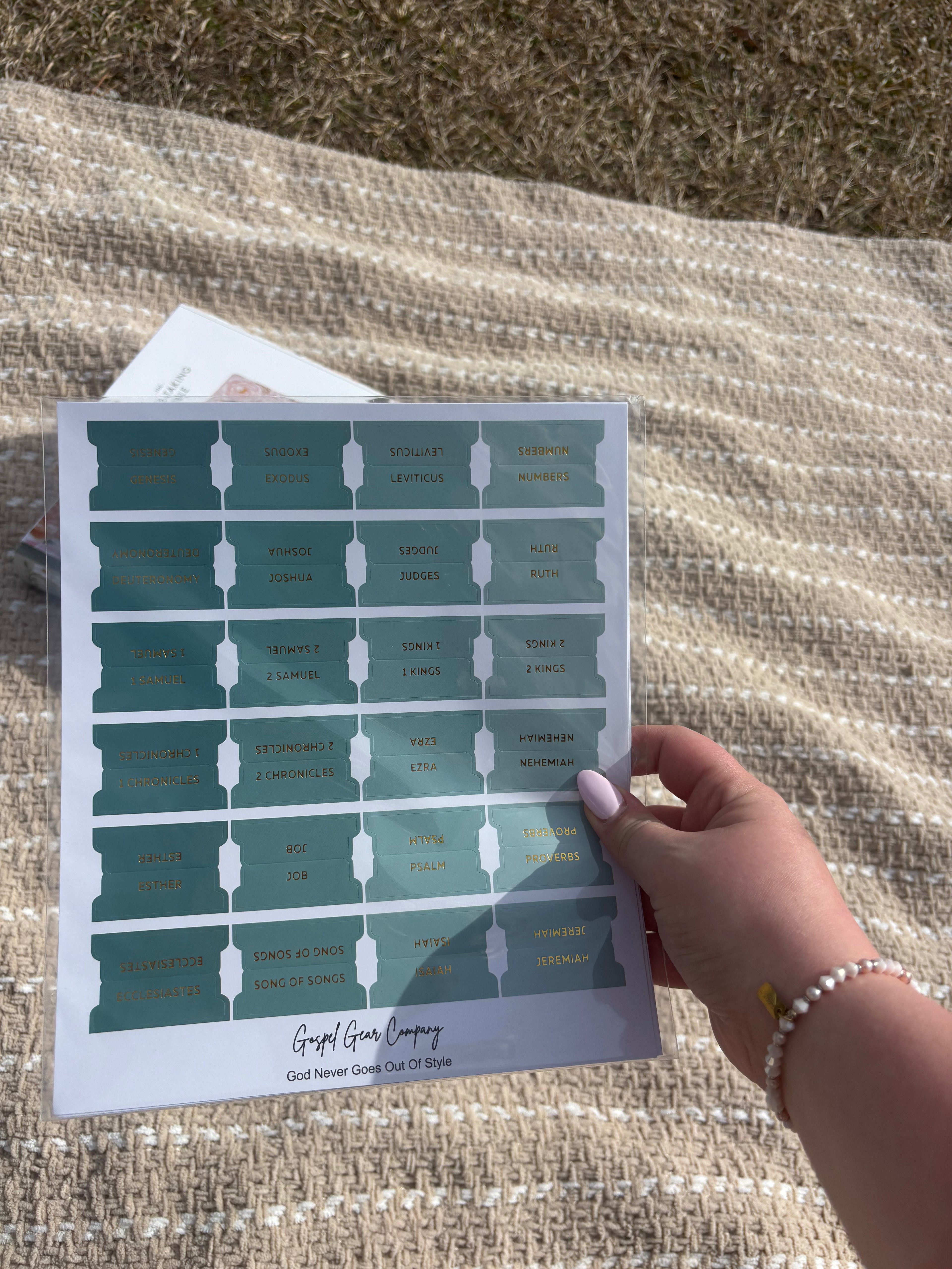 Sea Foam Green Bible tabs with floral Bibles laying on a beige blanket outside