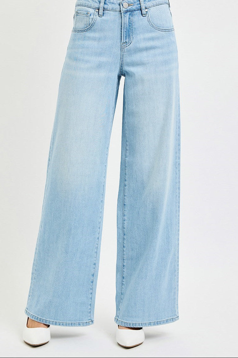 Light blue wide-leg jeans on a white background